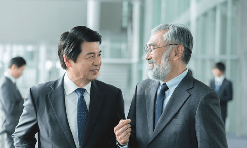 Two Japanese businessman smiling