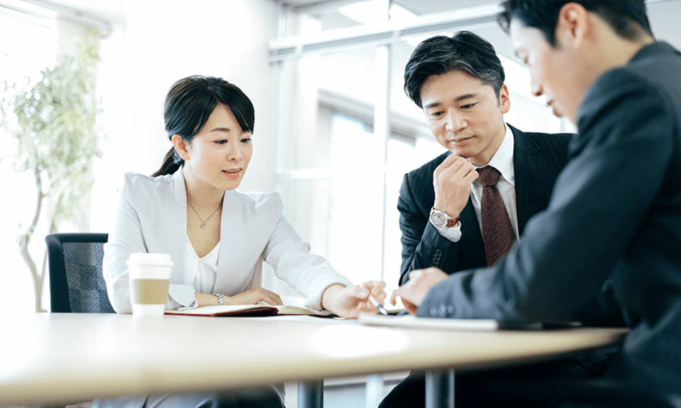 Japanese business people discussing